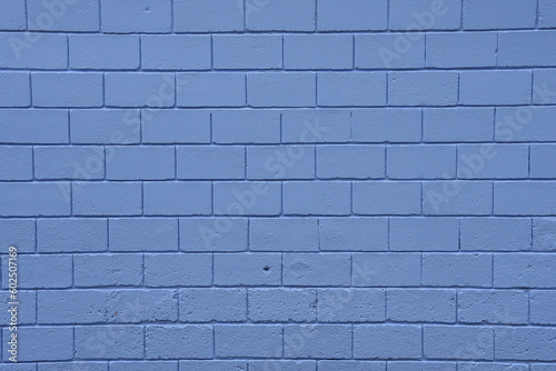 Light blue brick wall background. Textured in a pattern.