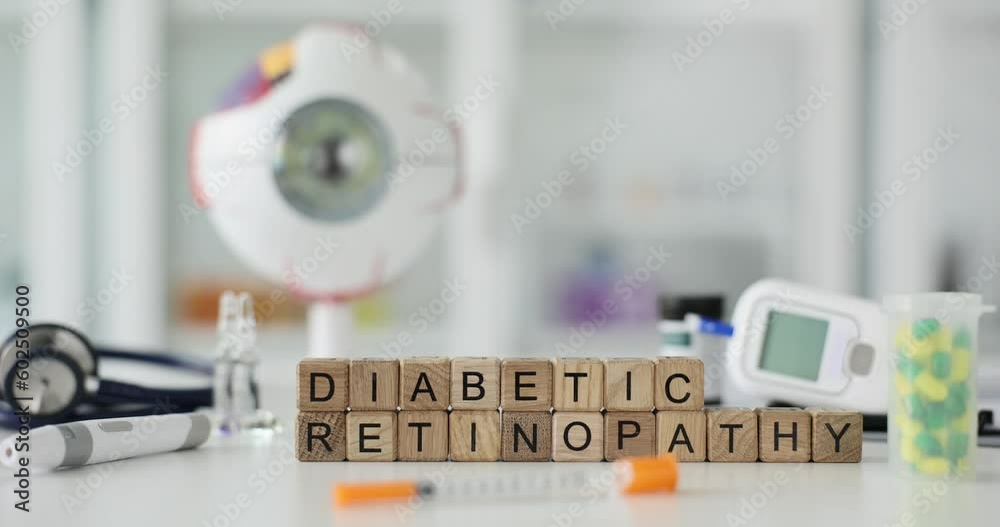 Phrase Diabetic Retinopathy made of wooden cubes against medical equipment, pills and model of eyeball. Risk of blindness in people with diabetes Phrase Diabetic Retinopathy made of wooden cubes against medical equipment, pills and model of eyeball. Risk of blindness in people with diabetes