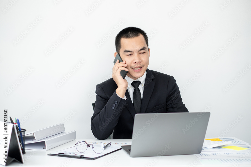 Smart businessman’s sitting in the office room and using mobile phone. Smart businessman’s sitting in the office room and using mobile phone.