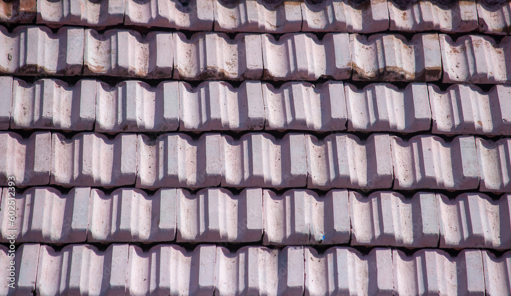 Roof tiles on guest house in rural area. Styling of roof with tiles. Roof tiles on guest house in rural area. Styling of roof with tiles.