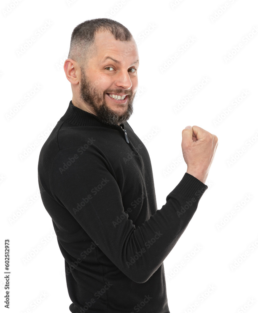 Portrait of thirty year old man celebrating surprised and amazed for success, isolated on white background. Bearde caucasian man in blackturtleneck clenching fist and posing in studio. Portrait of thirty year old man celebrating surprised and amazed for success, isolated on white background. Bearde caucasian man in blackturtleneck clenching fist and posing in studio.
