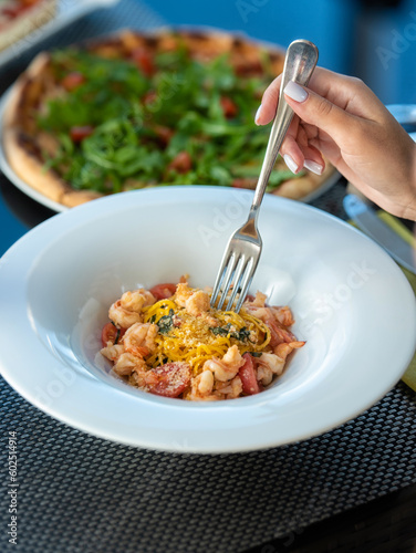 Tasty pasta with tomatoes and shrims photo