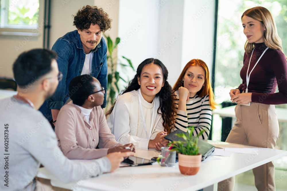 Group of multiethnic business people working together in the office Group of multiethnic business people working together in the office