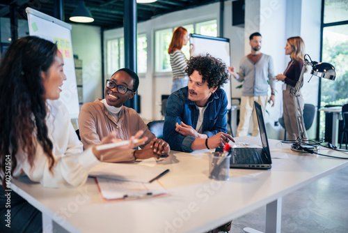Konstfotografi Group of multiethnic business people working together in the office