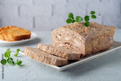 Chicken terrine. Chicken meat pate with fresh parsley