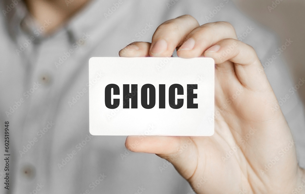 Card with text choice in a man's hand Card with text choice in a man's hand