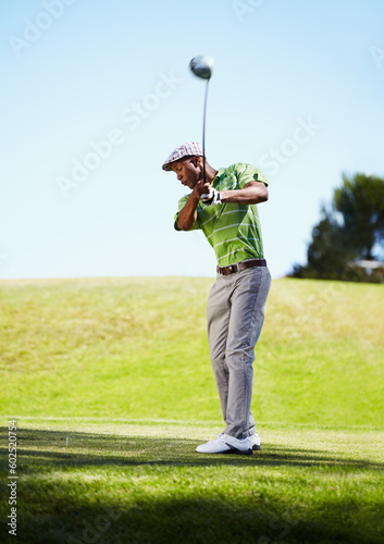 Sports, golf swing and black man with stroke in game, match and competition on golfing course. Recreation, hobby and male athlete with club driver on grass for training, fitness and golfer practice