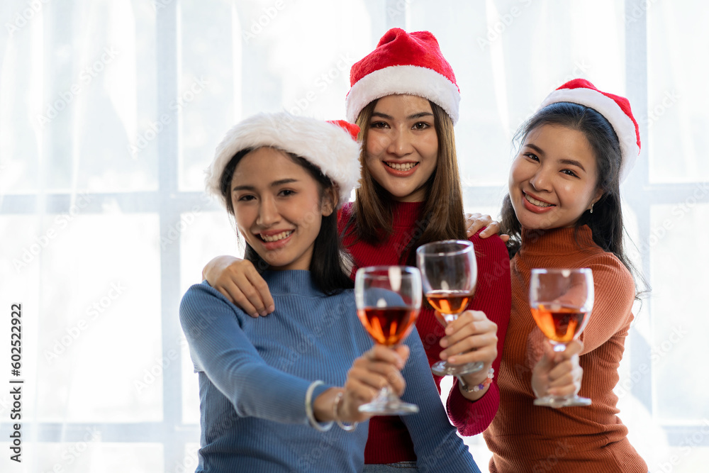 People toasting glasses of wine on the summer terrace of a cafe or restaurant with a group of friends in low light toasting wine. People toasting glasses of wine on the summer terrace of a cafe or restaurant with a group of friends in low light toasting wine.