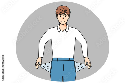 Stressed businessman show empty pockets