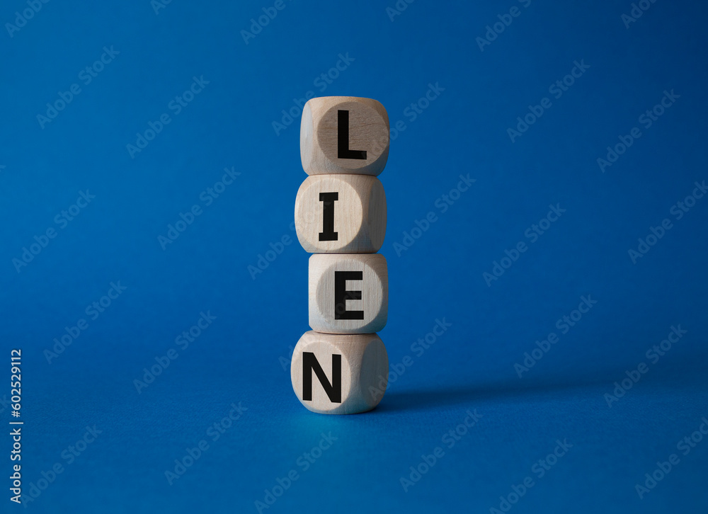 Lien symbol. Concept word Lien on wooden cubes. Beautiful blue background. Business and Lien concept. Copy space. Lien symbol. Concept word Lien on wooden cubes. Beautiful blue background. Business and Lien concept. Copy space.