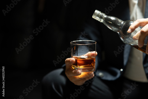 Businessmen in suits drinking Celebrate whiskey.