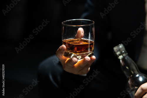 Businessmen in suits drinking Celebrate whiskey.