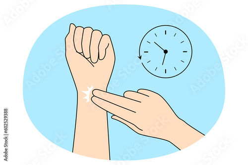 Person check radial pulse on wrist