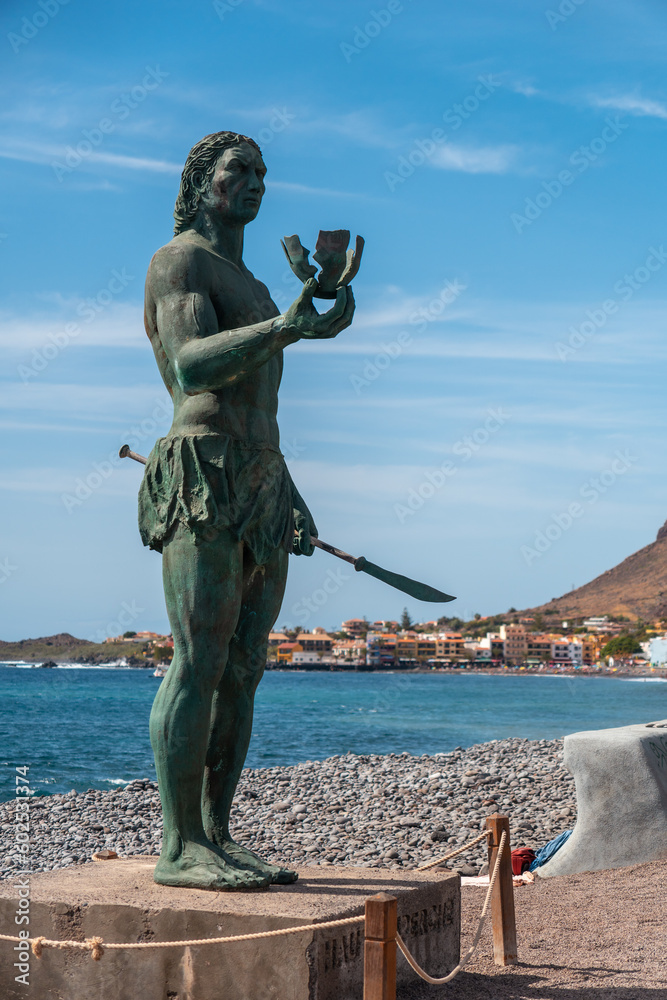Precious statue of Hautacuperche on the beach of Valle Gran Rey village in La Gomera, Canary Islands