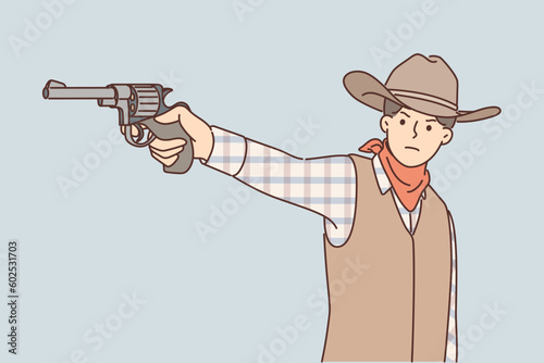 Man cowboy with revolver in hand is dressed in style of resident wild west and aiming at offender 
