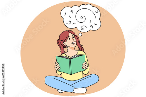 Smiling girl child read book imagining