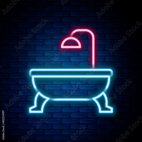 Glowing neon line Bathtub icon isolated on brick wall background. Colorful outline concept. Vector