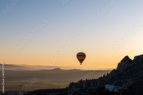 The hot air balloons flying above Goreme park, Sunrise time, Cappadocia, Turkey