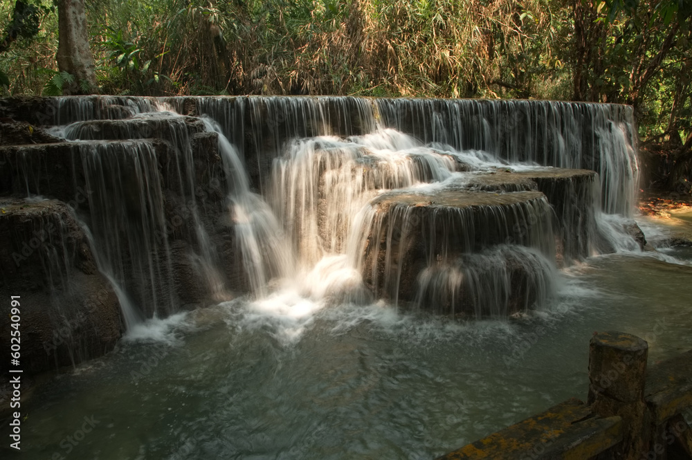 Tat Kuang Si Waterfalls is a limestone waterfall emerald green Inside the waterfall, there is an orderly tour arrangement. It is known as the most beautiful waterfall of Luang Prabang city in Laos.