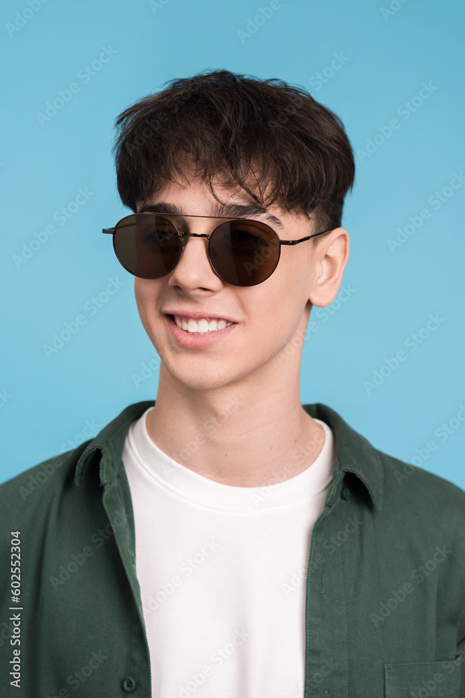 Portrait of a smiling young man in sunglasses