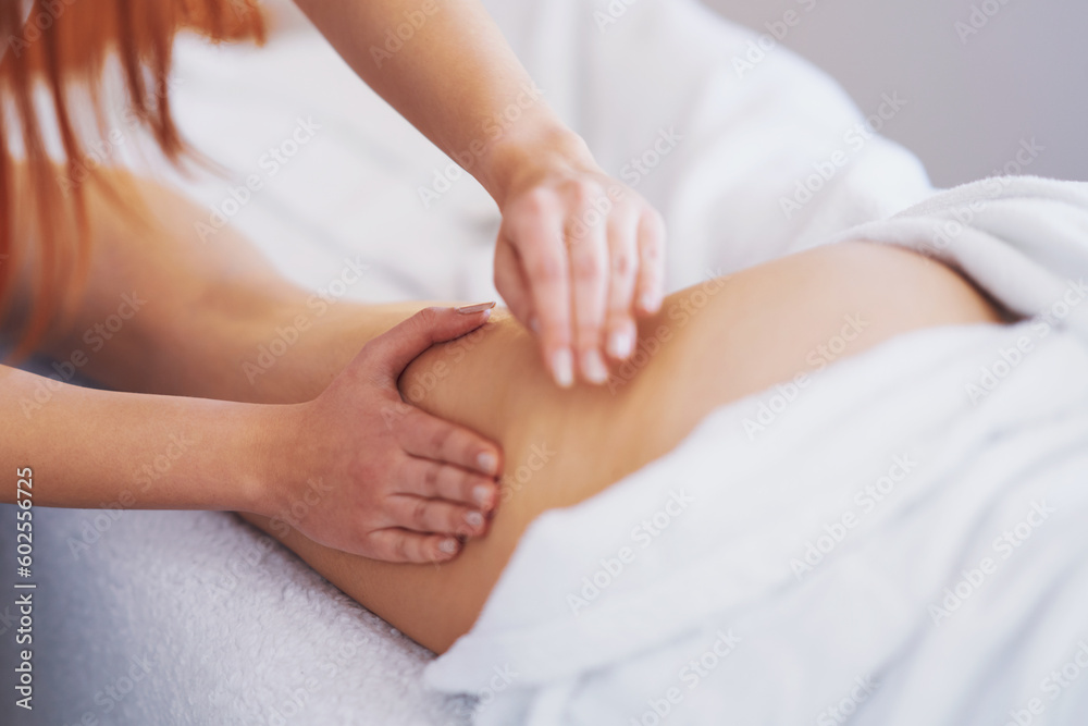 Woman having thigh and buttocks massage in salon Woman having thigh and buttocks massage in salon