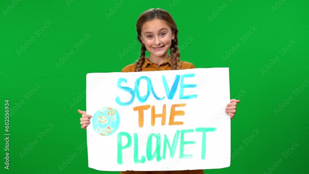 Girl opening Save the planet banner smiling looking at camera standing ...