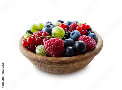 Mix berries in bowl on white background. Berries isolated on a white background. Raspberries  currants  blueberries  blackberries  gooseberries.