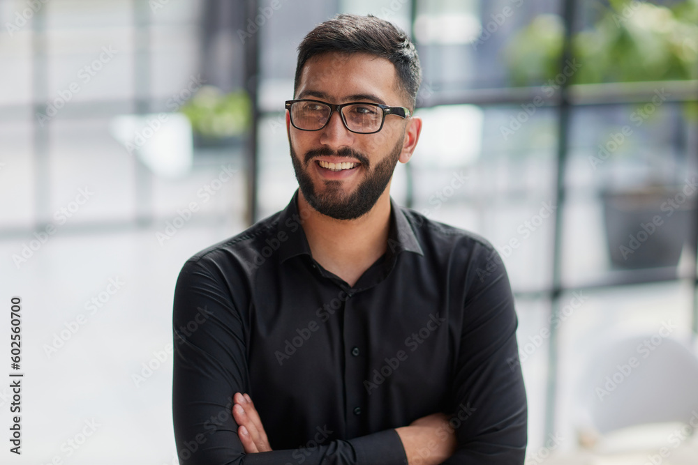Portrait of smiling young businessman in office Portrait of smiling young businessman in office