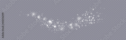 Particles of white magic dust. Shining light particles.Christmas glitter particles. Light effect on a transparent background