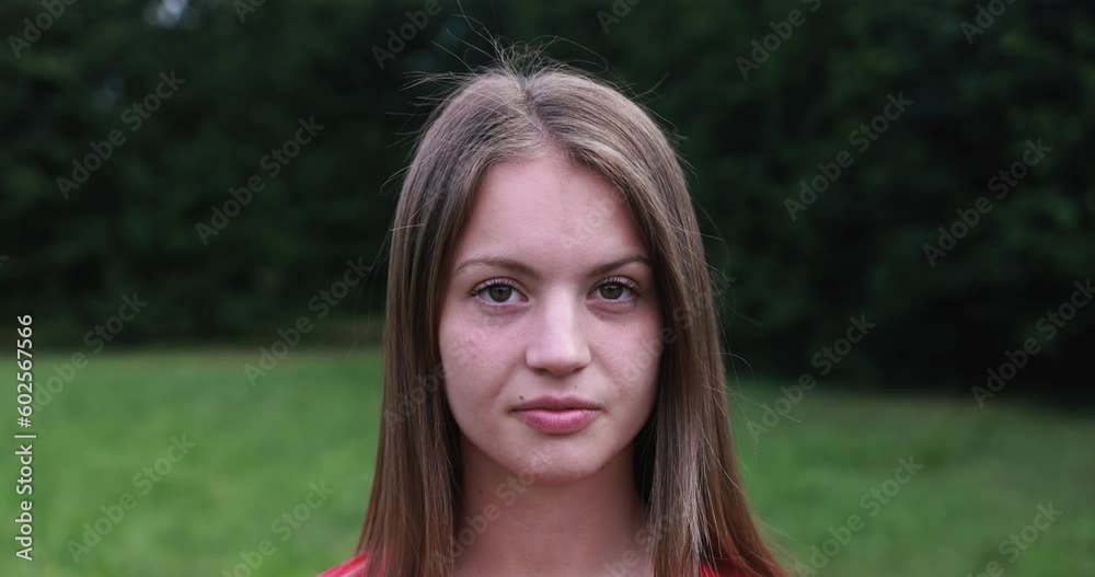 Young girl looking serious on camera outdoor Young girl looking serious on camera outdoor
