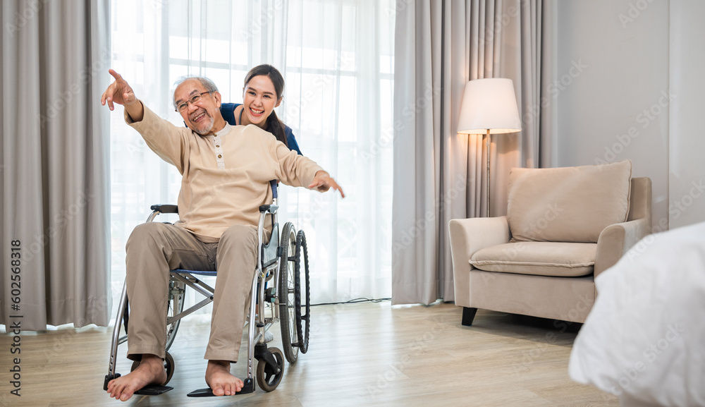Asian senior retired old man sitting on wheelchair having fun with young woman nurse, Happy curator person doctor pushing and running elderly patient freedom raising arm, sanatorium Asian senior retired old man sitting on wheelchair having fun with young woman nurse, Happy curator person doctor pushing and running elderly patient freedom raising arm, sanatorium