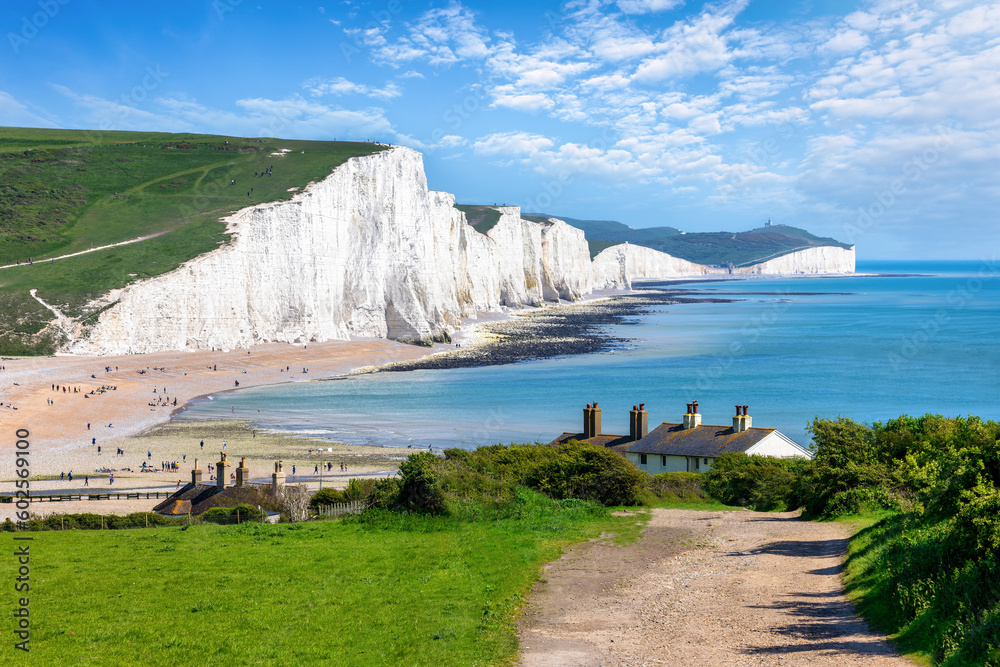 The Seven Sisters Chalk cliffs and the coastguard cottages during a eraly summer day, Seaford, East Sussex, England