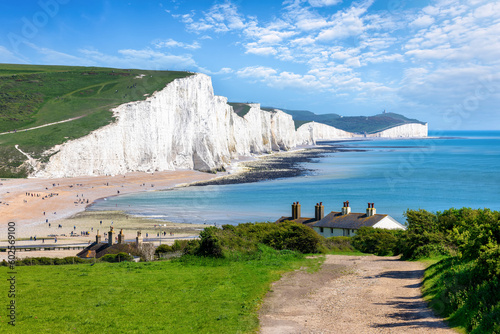 The Seven Sisters Chalk cliffs and the coastguard cottages during a eraly summer day, Seaford, East Sussex, England photo