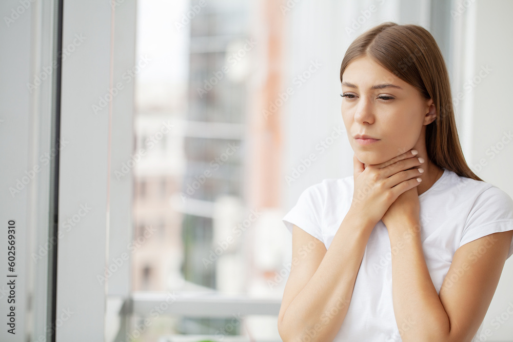 Young woman feeling exhausted and suffering from neck pain, health concept. Young woman feeling exhausted and suffering from neck pain, health concept.