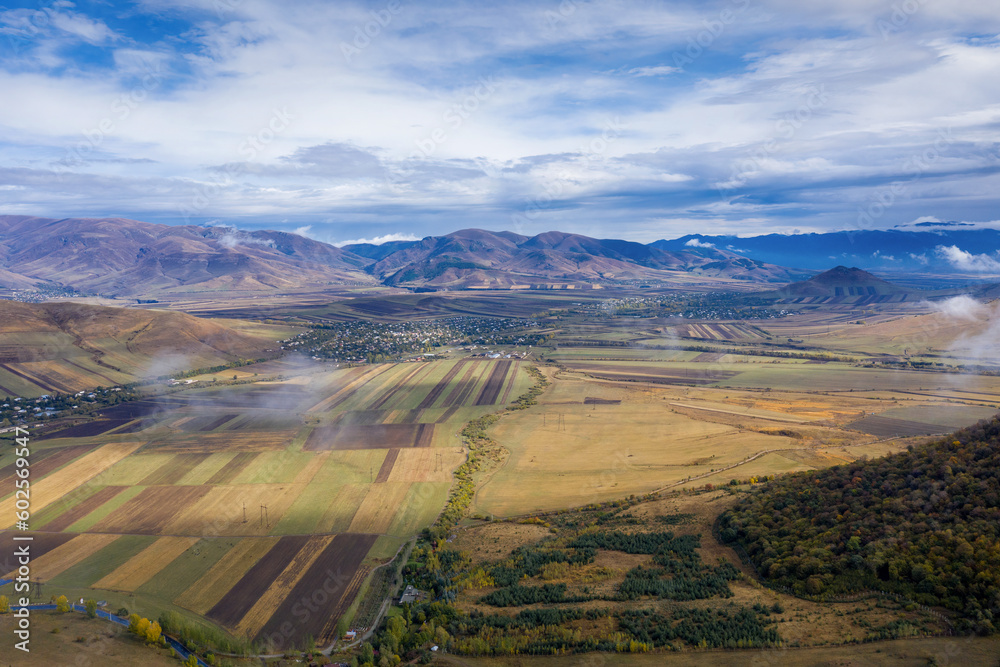 Aerial view of Gyulagarak village and Dzoraget river valley on sunny autumn day. Lori Province, Armenia.