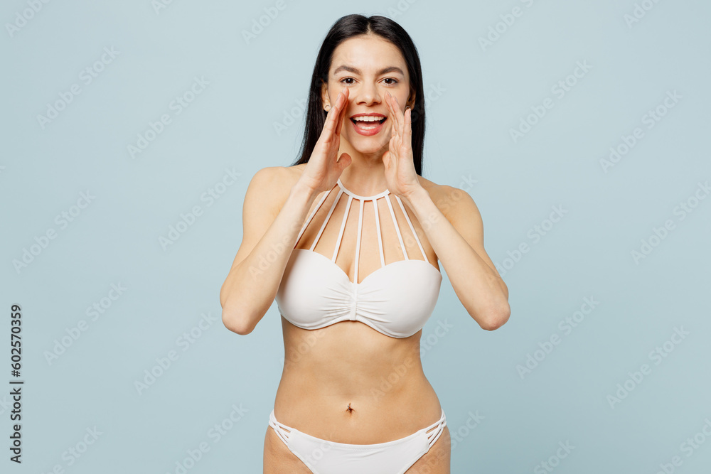 Young woman wear swimsuit scream share hot news about sales discount with hands near mouth near hotel pool isolated on plain pastel light blue cyan background Summer vacation sea rest sun tan concept Young woman wear swimsuit scream share hot news about sales discount with hands near mouth near hotel pool isolated on plain pastel light blue cyan background Summer vacation sea rest sun tan concept