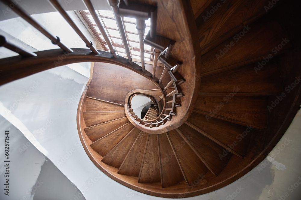 Fototapeta premium Top view of wooden spiral staircase in old church