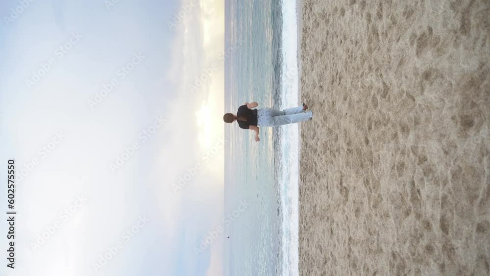 Young woman dancing alone on the beach. 4k Young woman dancing alone on the beach. 4k