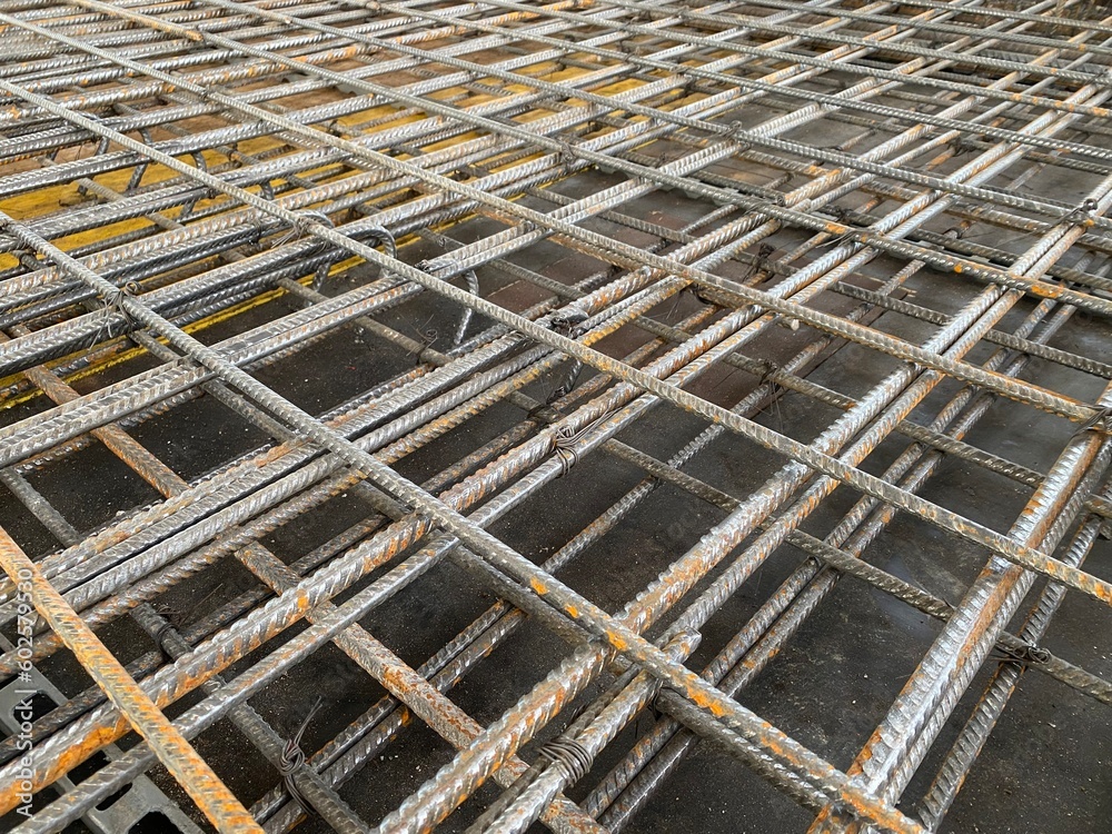 binding of reinforcement of a monolithic reinforced concrete slab of a residential building before pouring concrete