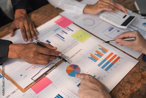 Business team working at office with documents on his desk, doing planning analyzing the financial report, business plan investment, finance analysis concept