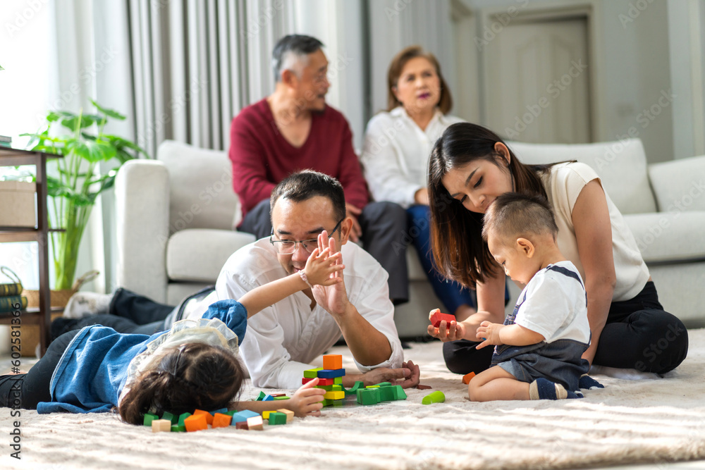 Portrait of enjoy happy love asian big family father and mother with little asian girl smiling activity learn and skill brain training play with toy build wooden blocks board education game at home Portrait of enjoy happy love asian big family father and mother with little asian girl smiling activity learn and skill brain training play with toy build wooden blocks board education game at home