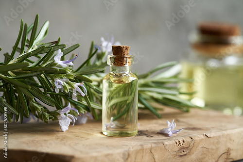 A bottle of rosemary essential oil on a table