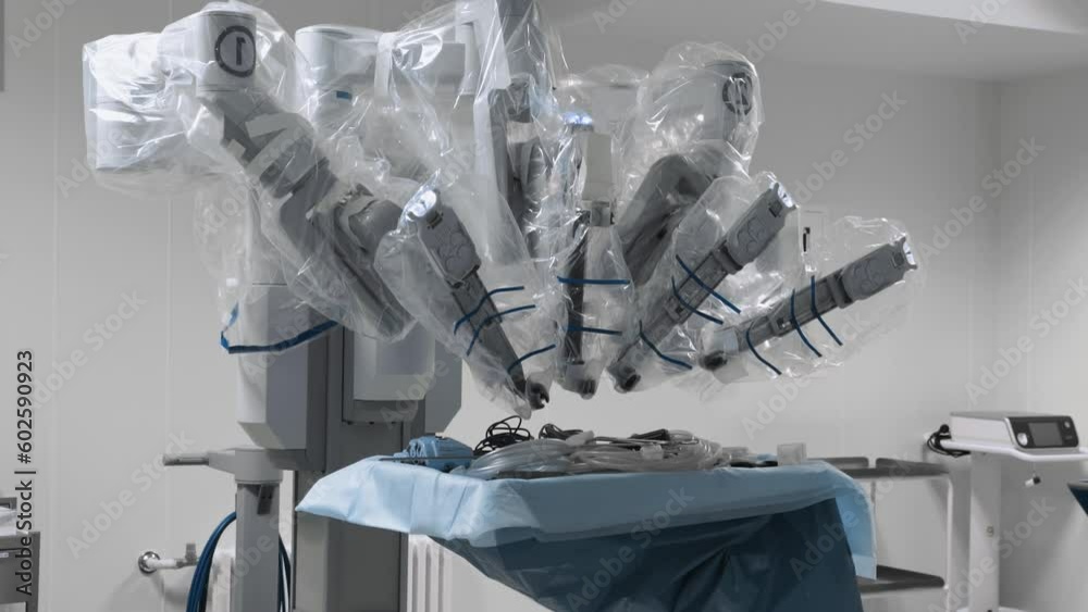 Medical surgical robot is ready for use in operating room. High-tech equipment in health care and invasive surgery at modern clinic