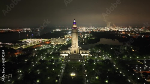 Louisiana state capitol building in Baton Rouge, Louisiana at night with drone video moving down. photo