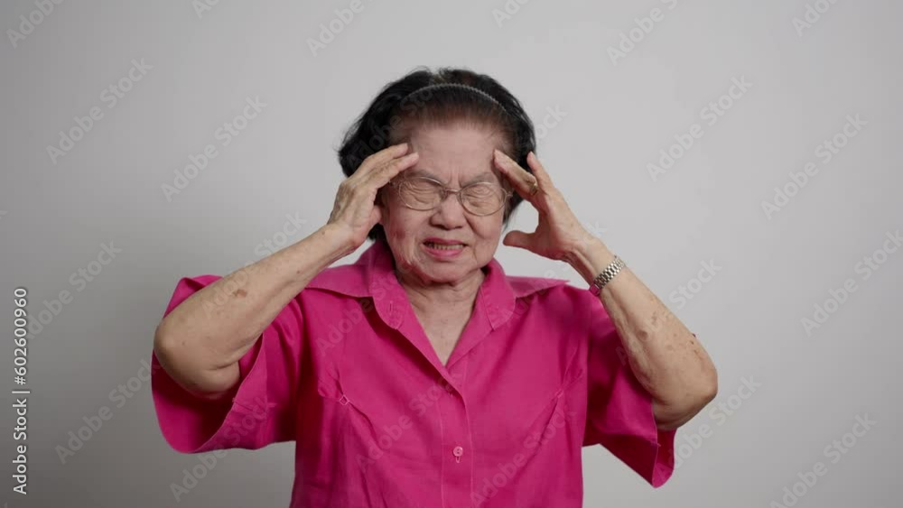 Sad elderly woman lonely mature sitting on couch at home. Tired sick mature old woman feeling unwell, touching head. Migraine pain, fatigue, stress concept. Depression, Alzheimer memory loss concept. Sad elderly woman lonely mature sitting on couch at home. Tired sick mature old woman feeling unwell, touching head. Migraine pain, fatigue, stress concept. Depression, Alzheimer memory loss concept.