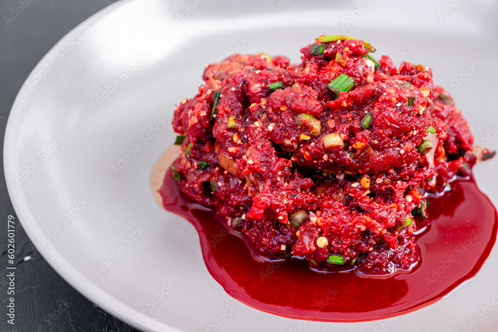 Soft focus Raw beef spicy minced meat salad, Northeastern Thailand local food Soft focus Raw beef spicy minced meat salad, Northeastern Thailand local food