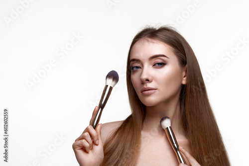 attractive woman with make-up brush for powder