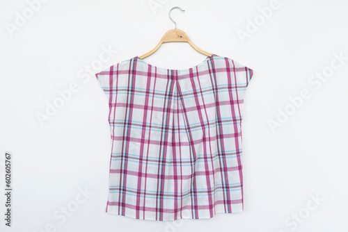 blouse with hanger wooden on background.