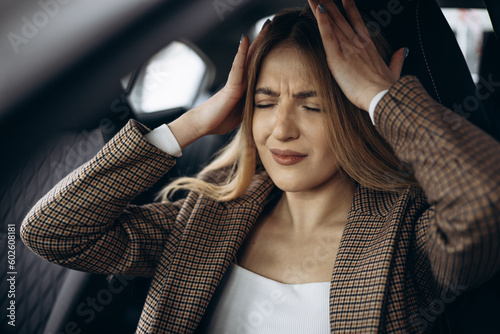 Woman sitting in car stressed photo