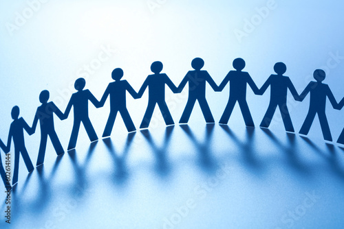 group of paper people holding hands